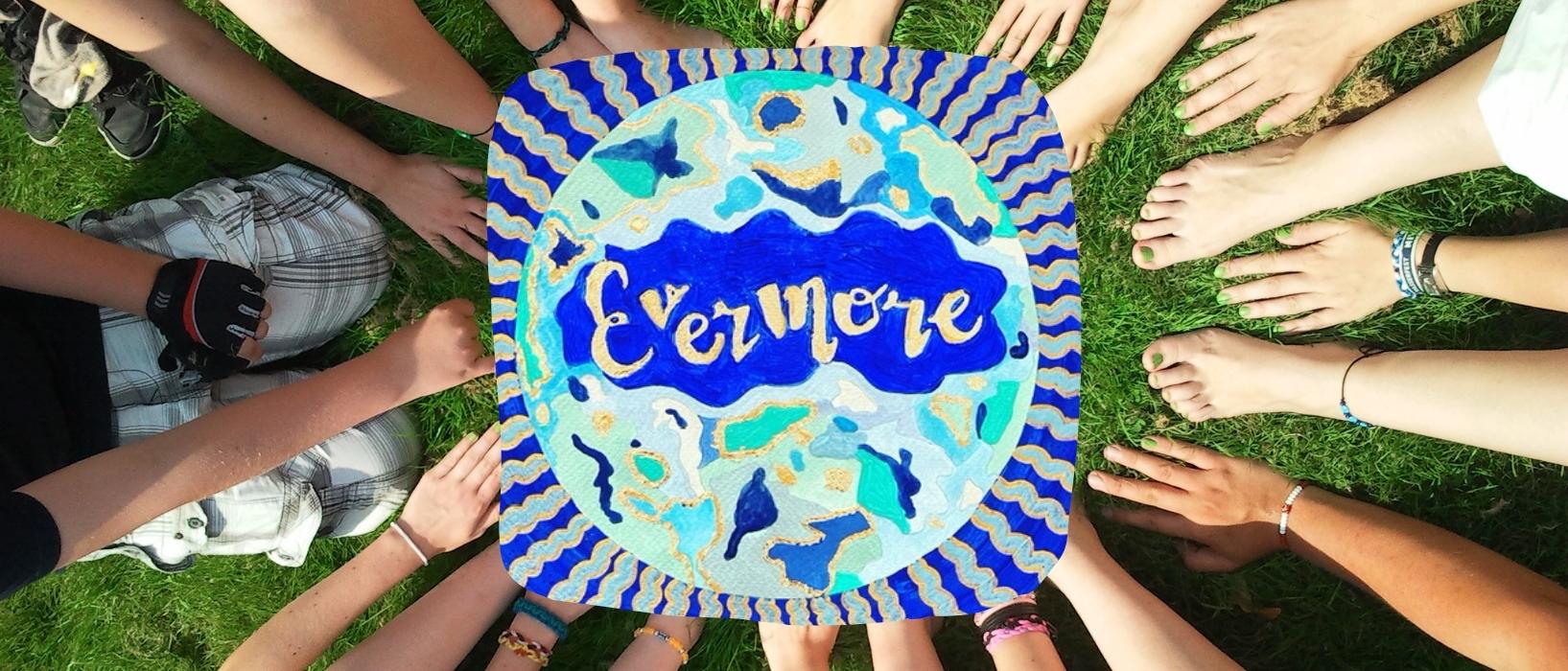 aerial shot of many hands and feet forming a circle, Evermore logo in the middle